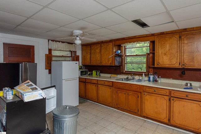 156 Spencer Rd, Jonesville, SC 29653 - kitchen with appliances with stainless steel finishes, a sink, a ceiling fan, light countertops, and brown cabinetry