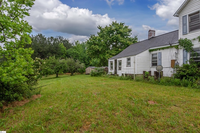 156 Spencer Rd, Jonesville, SC 29653 - view of green lawn featuring a shed and an outbuilding