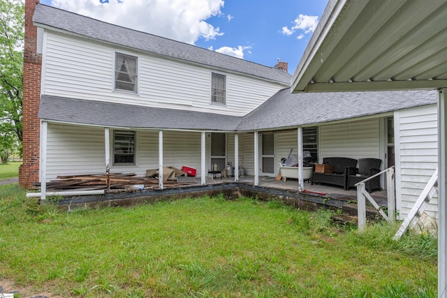 156 Spencer Rd, Jonesville, SC 29653 - back of property with a lawn, roof with shingles, and a chimney