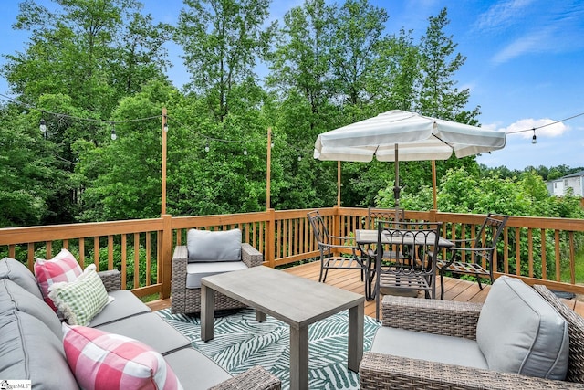 wooden terrace featuring an outdoor hangout area and outdoor dining space
