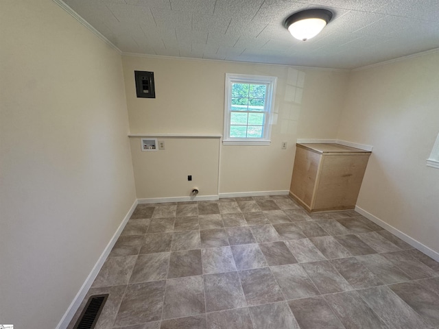 washroom with electric dryer hookup, washer hookup, baseboards, crown molding, and electric panel