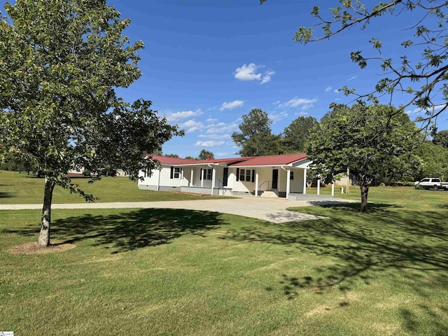 ranch-style house with a front lawn and covered porch
