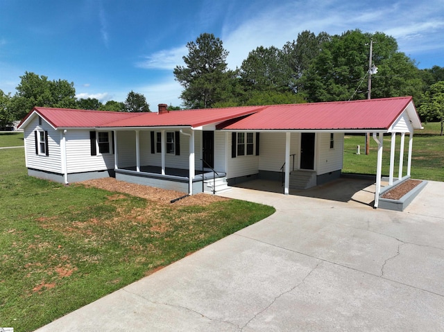 ranch-style house featuring crawl space, an attached carport, a front yard, and concrete driveway