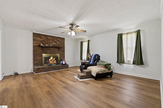 205 Woodfield Dr, Piedmont, SC 29673 - sitting room with ceiling fan, a textured ceiling, wood finished floors, ornamental molding, and baseboards