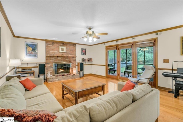 111 Golf View Ln, Greenville, SC 29609 - living room featuring ornamental molding, a ceiling fan, light wood finished floors, baseboards, and a brick fireplace