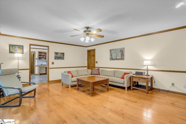 111 Golf View Ln, Greenville, SC 29609 - living room featuring ceiling fan, light wood finished floors, crown molding, and baseboards