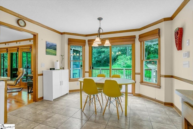 111 Golf View Ln, Greenville, SC 29609 - dining room featuring crown molding, a textured ceiling, light tile patterned floors, and baseboards