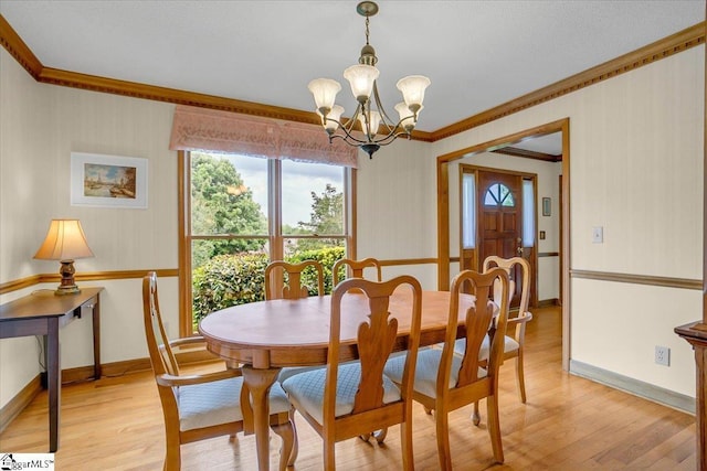 111 Golf View Ln, Greenville, SC 29609 - dining area featuring crown molding, a chandelier, healthy amount of natural light, and light wood-type flooring