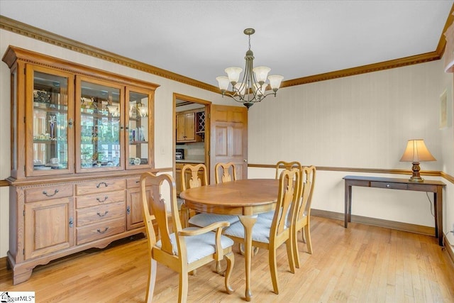 111 Golf View Ln, Greenville, SC 29609 - dining space featuring a chandelier, light wood-style floors, ornamental molding, and baseboards