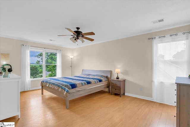 111 Golf View Ln, Greenville, SC 29609 - bedroom featuring light wood-type flooring, crown molding, baseboards, and a ceiling fan