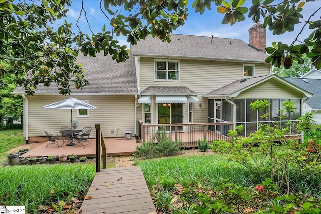 111 Golf View Ln, Greenville, SC 29609 - back of property with a sunroom, a wooden deck, a chimney, roof with shingles, and outdoor dining space