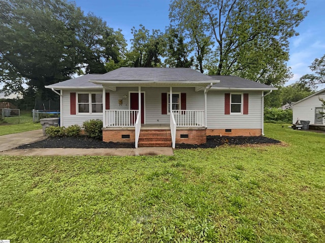 245 Rigby Ave, Spartanburg, SC 29306 - view of front of house with crawl space, covered porch, a trampoline, a front yard, and a shingled roof