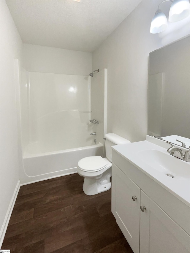 245 Rigby Ave, Spartanburg, SC 29306 - bathroom featuring wood finished floors, toilet, washtub / shower combination, and vanity