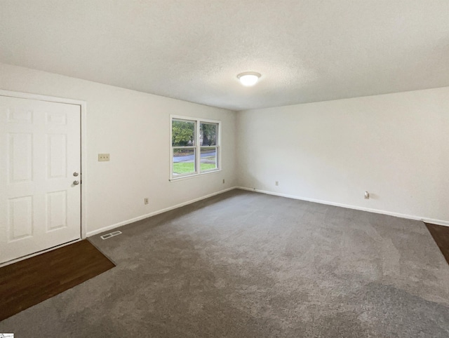 245 Rigby Ave, Spartanburg, SC 29306 - spare room featuring dark colored carpet and baseboards