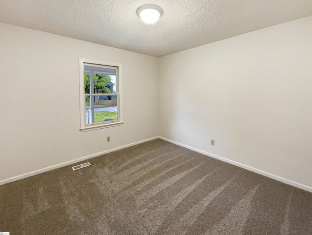 245 Rigby Ave, Spartanburg, SC 29306 - unfurnished room with dark colored carpet, baseboards, and a textured ceiling