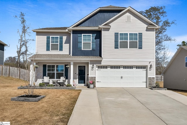121 Frost Flower Way, Fountain Inn, SC 29644 - view of front of property with a porch, driveway, stone siding, and a garage