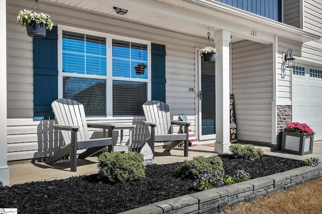 121 Frost Flower Way, Fountain Inn, SC 29644 - doorway to property with a porch, a garage, and stone siding