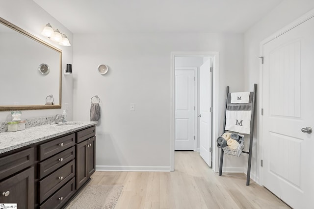121 Frost Flower Way, Fountain Inn, SC 29644 - bathroom featuring wood finished floors, vanity, and baseboards