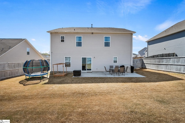 121 Frost Flower Way, Fountain Inn, SC 29644 - back of house featuring a trampoline and a patio