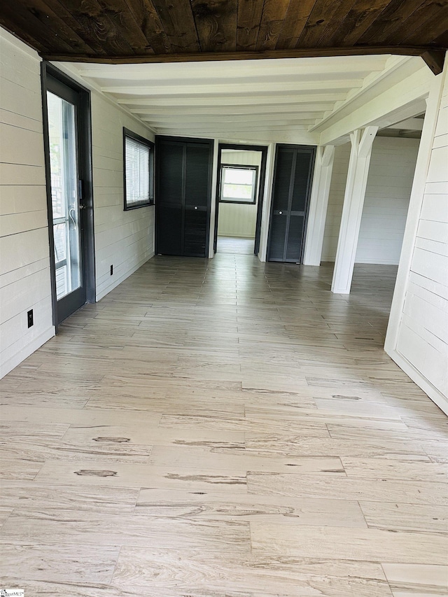 unfurnished room featuring wood ceiling and light wood finished floors