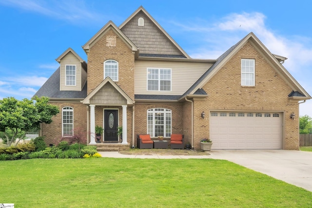 view of front of house with an attached garage, brick siding, driveway, a front lawn, and roof with shingles