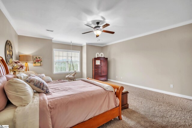 bedroom with carpet flooring, baseboards, ornamental molding, and a ceiling fan