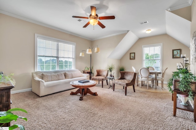 carpeted living room featuring ceiling fan, ornamental molding, and baseboards