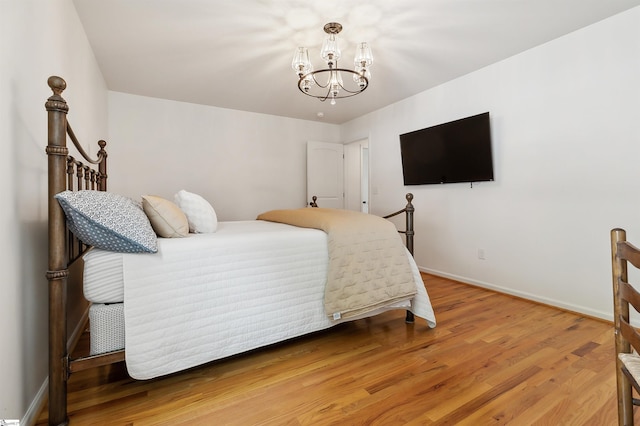 31 Goodwin Farms Ct, Travelers Rest, SC 29690 - bedroom featuring a chandelier, light wood-type flooring, and baseboards