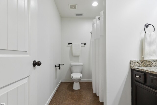 31 Goodwin Farms Ct, Travelers Rest, SC 29690 - bathroom featuring baseboards, vanity, toilet, and tile patterned floors