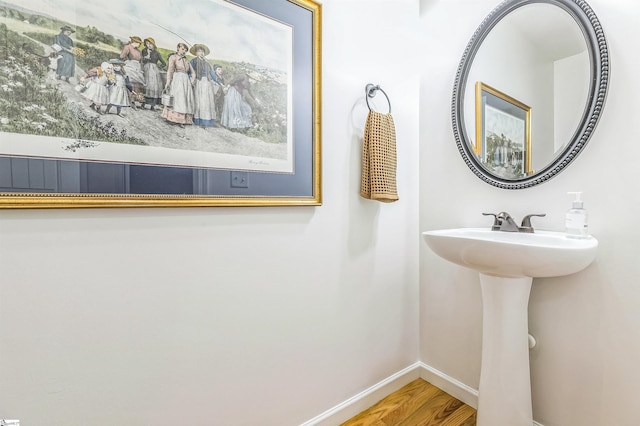 31 Goodwin Farms Ct, Travelers Rest, SC 29690 - bathroom featuring baseboards, wood finished floors, and a sink