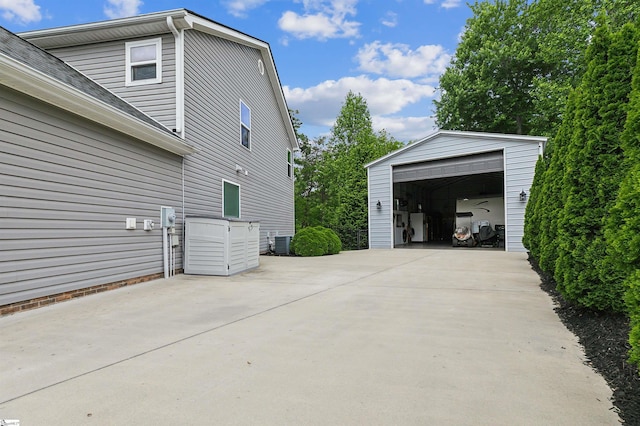 31 Goodwin Farms Ct, Travelers Rest, SC 29690 - view of side of home featuring a garage, an outbuilding, and central AC