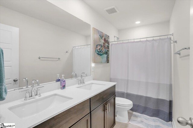 204 Hazelcroft Dr, Fountain Inn, SC 29644 - full bath with toilet, double vanity, tile patterned floors, and recessed lighting