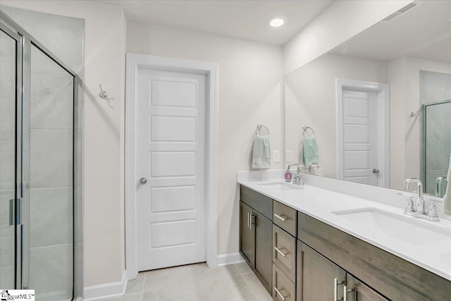 204 Hazelcroft Dr, Fountain Inn, SC 29644 - full bath featuring a shower stall, tile patterned flooring, double vanity, and baseboards