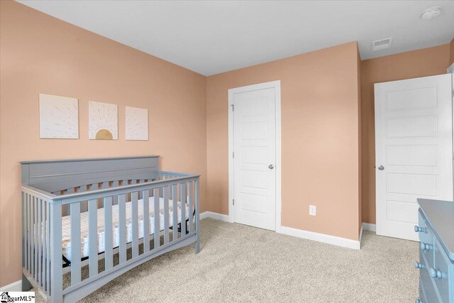 204 Hazelcroft Dr, Fountain Inn, SC 29644 - bedroom with baseboards, carpet floors, and a nursery area