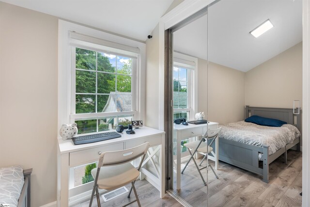 11 Adger St, Pelzer, SC 29669 - bedroom with vaulted ceiling, multiple windows, wood finished floors, and a desk