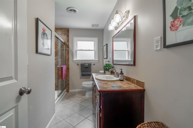 full bath featuring toilet, a shower stall, vanity, tile patterned flooring, and baseboards