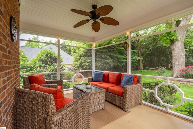 sunroom with a ceiling fan, an outdoor hangout area, and healthy amount of natural light