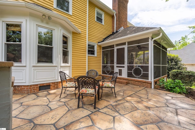 view of patio / terrace with a sunroom and outdoor dining area