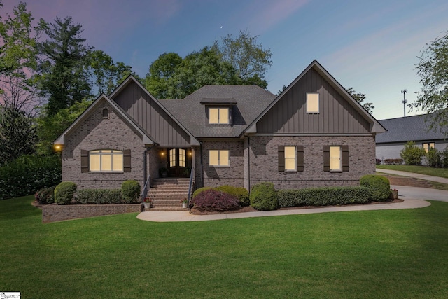 15 Paddington Ave, Greenville, SC 29609 - craftsman-style home featuring board and batten siding, a lawn, and brick siding