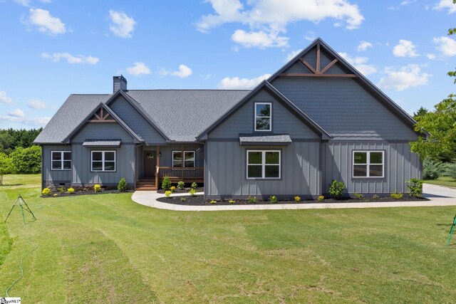 21 Old American Blvd, Pendleton, SC 29670 - view of front of house featuring board and batten siding, a chimney, a front lawn, a shingled roof, and a porch