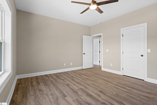 21 Old American Blvd, Pendleton, SC 29670 - unfurnished bedroom with wood finished floors, baseboards, and ceiling fan
