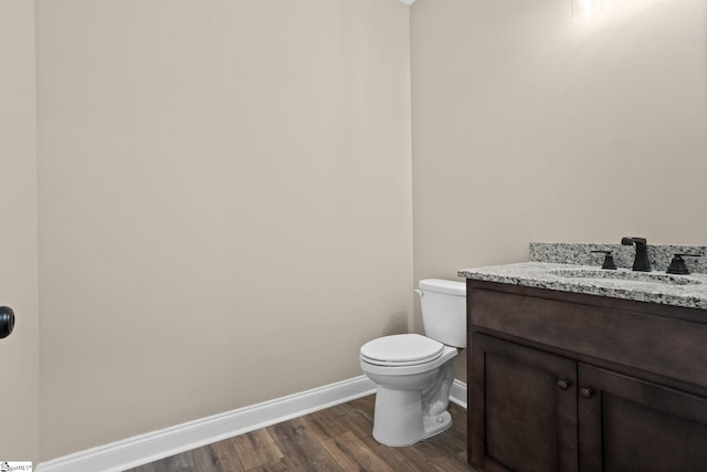 21 Old American Blvd, Pendleton, SC 29670 - half bathroom featuring baseboards, vanity, toilet, and wood finished floors