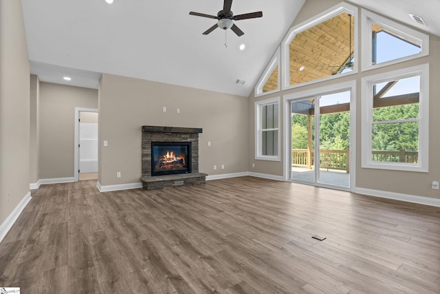 21 Old American Blvd, Pendleton, SC 29670 - unfurnished living room with high vaulted ceiling, ceiling fan, a stone fireplace, wood finished floors, and baseboards