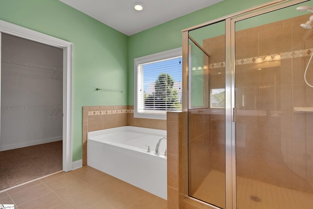 9 Sheldrake Pl, Simpsonville, SC 29681 - bathroom featuring a bath, a stall shower, tile patterned floors, and a walk in closet