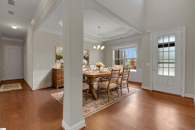 9 Sheldrake Pl, Simpsonville, SC 29681 - dining room with wood finished floors, crown molding, a chandelier, baseboards, and a tray ceiling