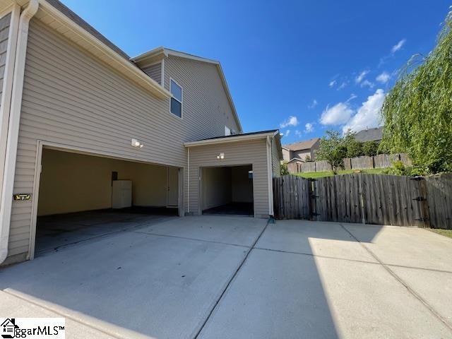 9 Sheldrake Pl, Simpsonville, SC 29681 - view of home's exterior with concrete driveway, fence, and a garage