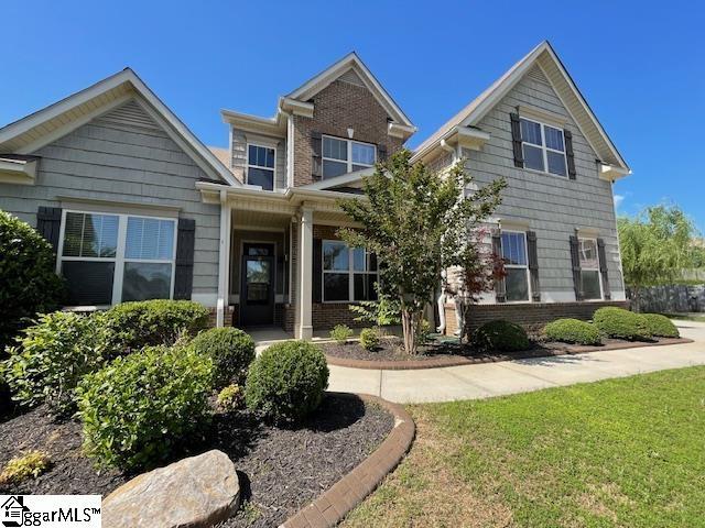 9 Sheldrake Pl, Simpsonville, SC 29681 - view of front facade featuring brick siding and a front lawn