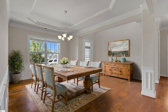 9 Sheldrake Pl, Simpsonville, SC 29681 - dining space featuring a tray ceiling, a chandelier, wood finished floors, and crown molding