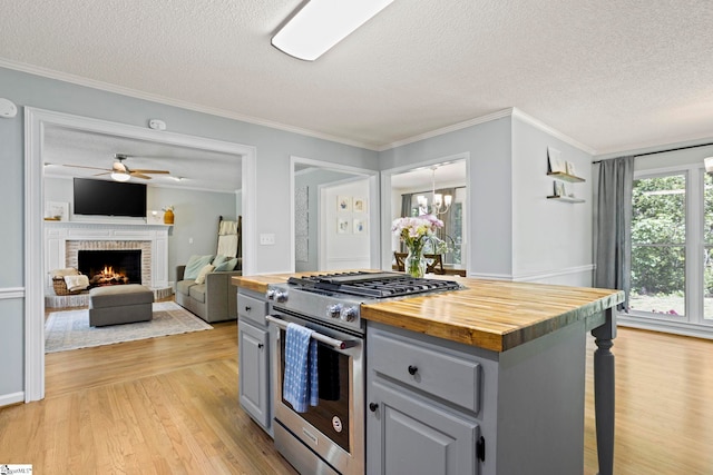202 Shadow Oaks Dr, Easley, SC 29642 - kitchen featuring high end stove, gray cabinets, a textured ceiling, wooden counters, and light wood-type flooring