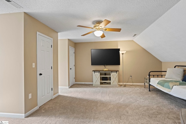 202 Shadow Oaks Dr, Easley, SC 29642 - living area with carpet flooring, ceiling fan, a textured ceiling, baseboards, and vaulted ceiling